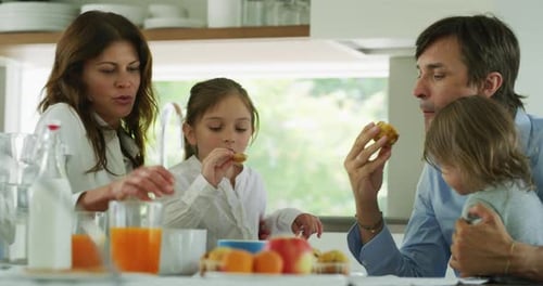 Family Having Breakfast in Modern Kitchen