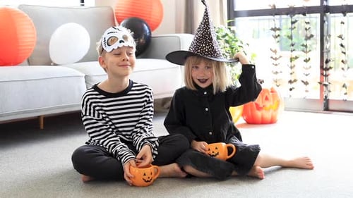Children Celebrating Halloween With Costumes and Decorations