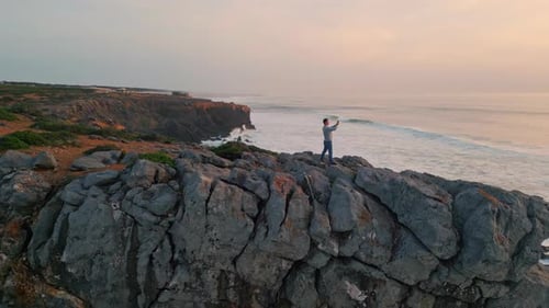 Traveler Taking Picture Sunset Ocean Sea Waves Reflecting Sun Marine Nature