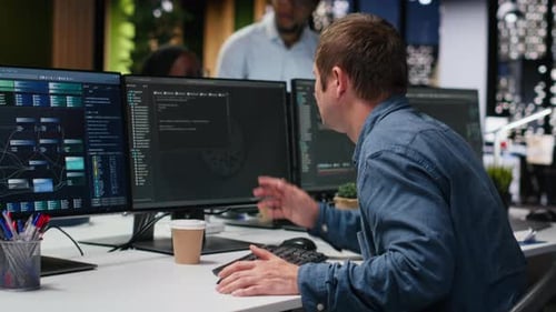 System Administrator in Company Workplace Doing Tech Quality Assurance