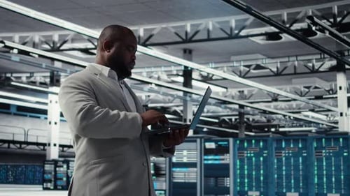 Smiling Data Center Technician Installing and Upgrading Hardware Components