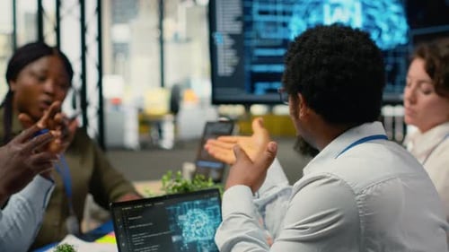 System Administrators Working in AI Startup Training Predictive Models