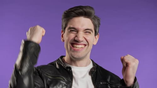 Excited Man Cheering with Black Leather Jacket