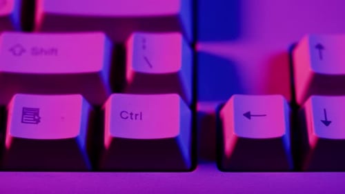 Keyboard Close Up with Purple and Blue Lights