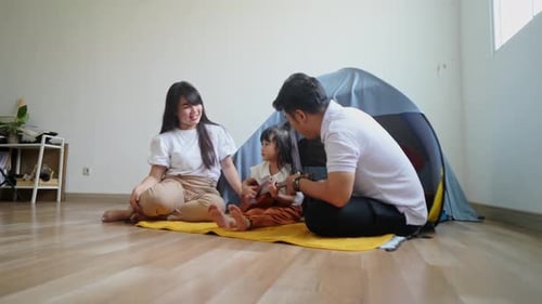 Family Enjoys Playing Music Together Indoors