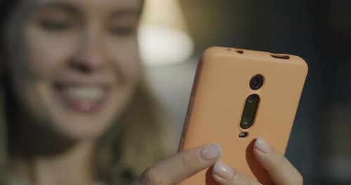 Young Adult Using Touchscreen Mobile Phone