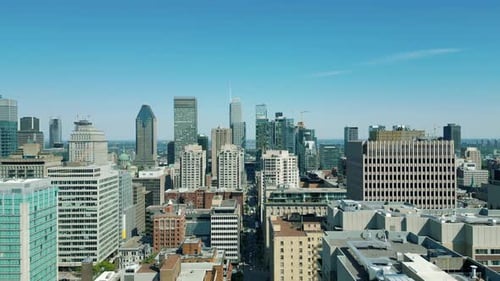 4K Cinematic urban drone footage of an aerial view of buildings and skyscrapers in the middle of dow