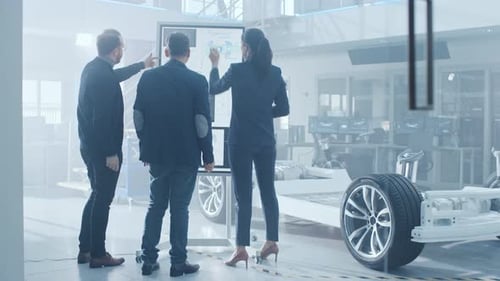 Automotive Engineers Collaborate in Modern Research Facility