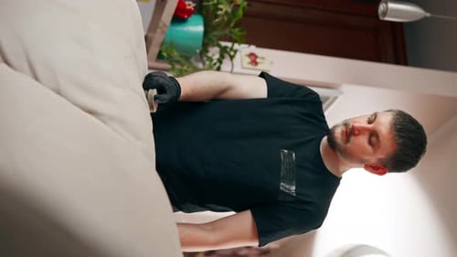 Adult Cleaning Couch with Brush Indoors