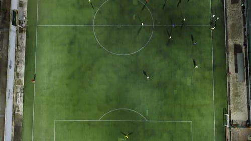 soccer players train in a friendly game at night
