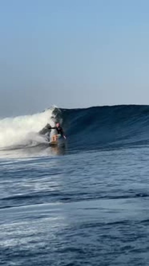 Man Surfing a Wave in the Ocean
