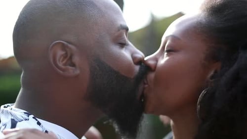 Romantic Adult Couple Kissing and Embracing Affectionately