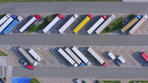 Top Down Aerial View of Semi Trucks Parked in Rows