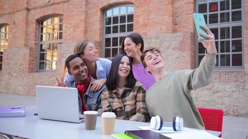 Smiling Friends Take Selfie Together Outdoors