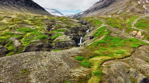 Waterfall in the Mountains Clear Glacial River Flows in the Canyon Iceland Summer Nature Clear Sunny
