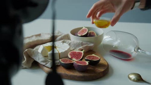 Close up of Brie, Figs, and Red Wine