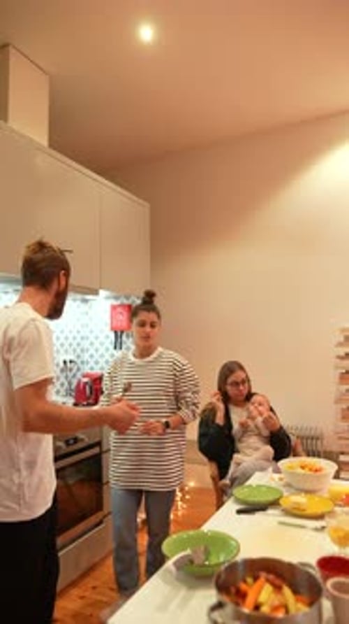 Family Prepares Food Together in a Home Kitchen