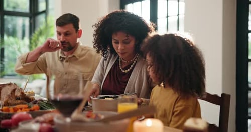 Family Enjoys Meal at Home Dining Table