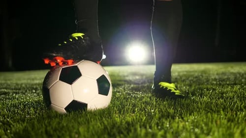 Soccer Player Athlete Training Foot Ball Sport on Soccer Field at Night