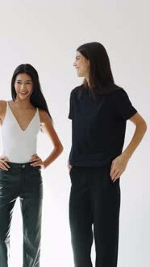 Fashion Models Posing in Slow Motion on White Background