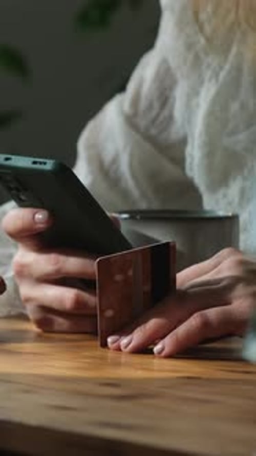 Vertical Video Person Making Payments on Ecommerce Sites with Bank Card