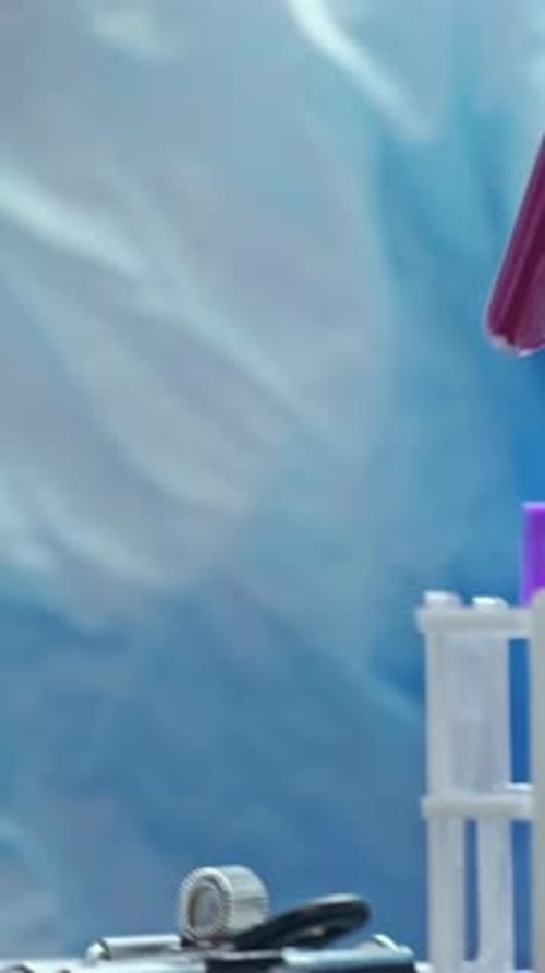 Medical Professional with Blood Samples and Clipboard