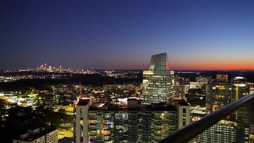 Buckhead and Downtown Atlanta skyline at night.