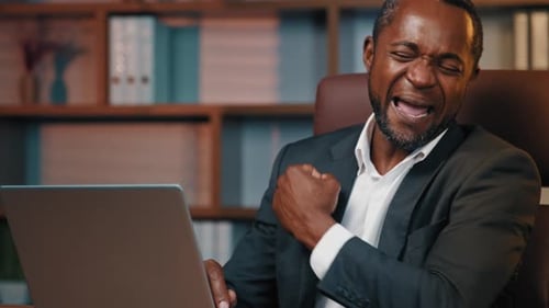 Focused Businessman Office Worker Typing on Laptop Happy Male Winner Reads Good News Rejoices in
