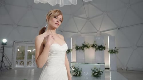 Woman Smiles in Elegant Strapless Wedding Gown