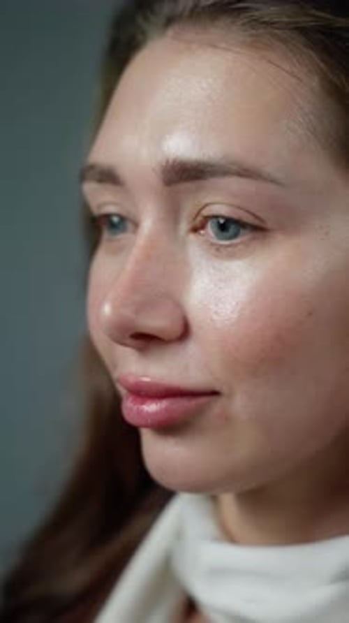 Woman Applying Makeup With Brush Close-Up
