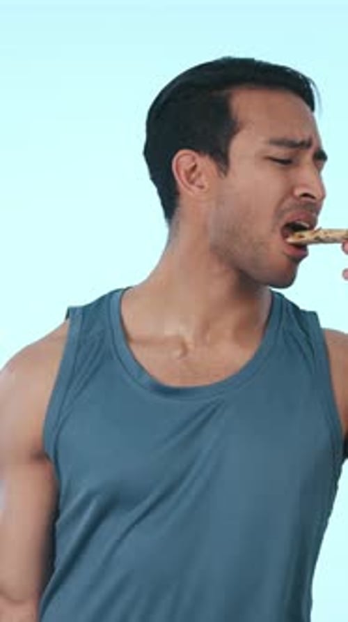 Weights, pizza and man in studio with choice for wellness, eating and exercise for healthy body