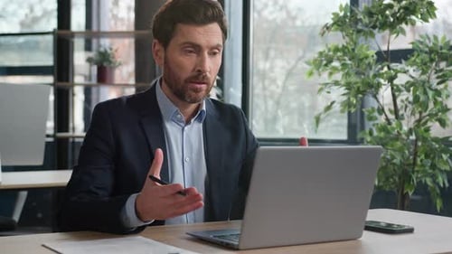 Serious Caucasian Businessman Talking Video Call Laptop in Office Man Entrepreneur Leader Hr Manager