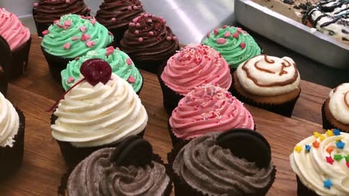 Colorful Frosted Cupcakes with Sprinkles, Cherries and More