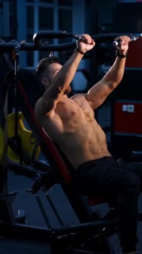 Fit young man lifting barbells doing workout at a gym. Sport, fitness, weightlifting, bodybuilding,