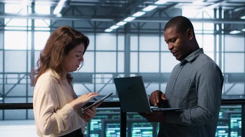 Server Farm Workers Using Devices to Perform Vulnerability Scans