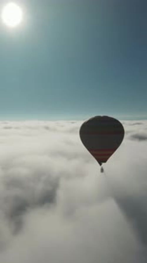 Silent Balloon Over Fog Gentle Flight Through Misty Skies Serene Floating High Above Cloudy Sea
