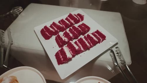 Delicious Sliced Red Velvet Cake on White Plate