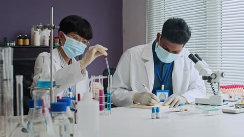 Scientists Working in Lab Conducting Research