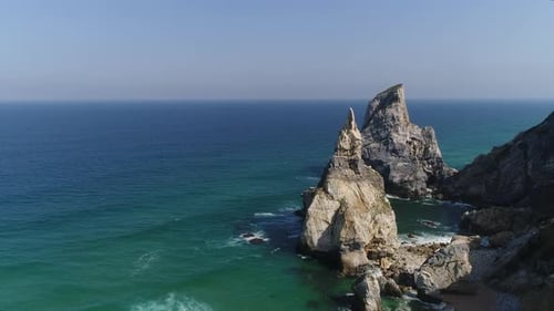 Breathtaking ocean aerial with beautiful sea. beach with rough rock formations. Portugal, Sintra