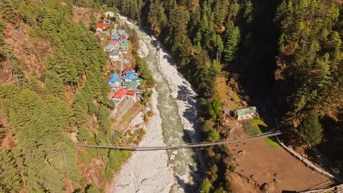 Jorsale Valley Revealing Meandering Dudh Kosi River Suspension Bridge Linking Wooden Structures Amid