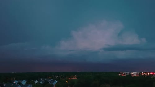 Drone Shot of Stormy Clouds Forming on Gloomy Sky Before Heavy Rainfall and Lightning Over Suburban