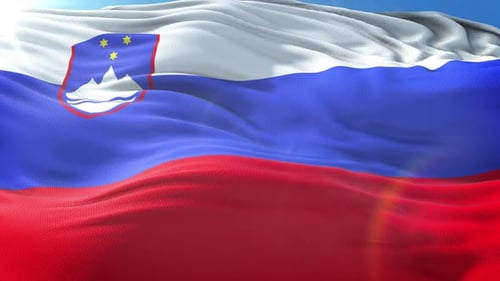 Realistic Slovenian National Flag Waving Loop with Blue Sky