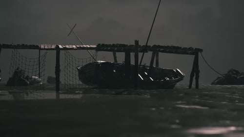 Dark Waters Feature a Small Boat Docked Under a Wooden Pier at Night