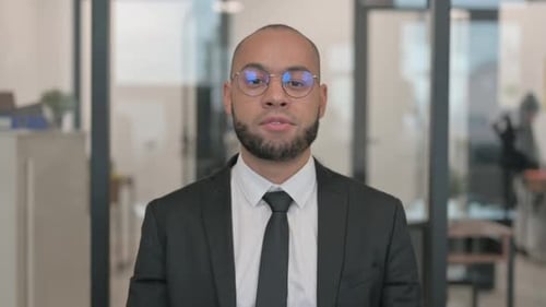 Business Man Giving a Virtual Presentation in Office