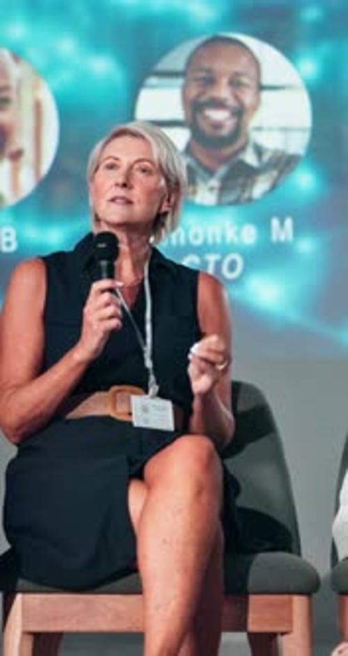 Businesswoman Giving Presentation at Corporate Event