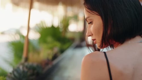 Young Woman with Short Hair in Tropical Setting