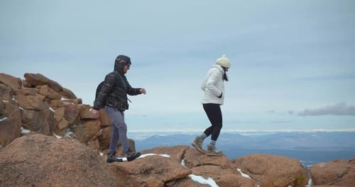 Couple Hiking Summit of Rocky Mountains, Climbing, Hiking Peak Adventure