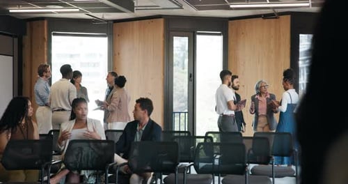 Business Professionals Networking Before Conference in Modern Office