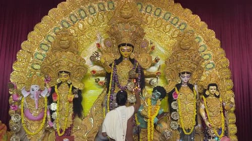 Golden Deities in Elaborate Religious Shrine