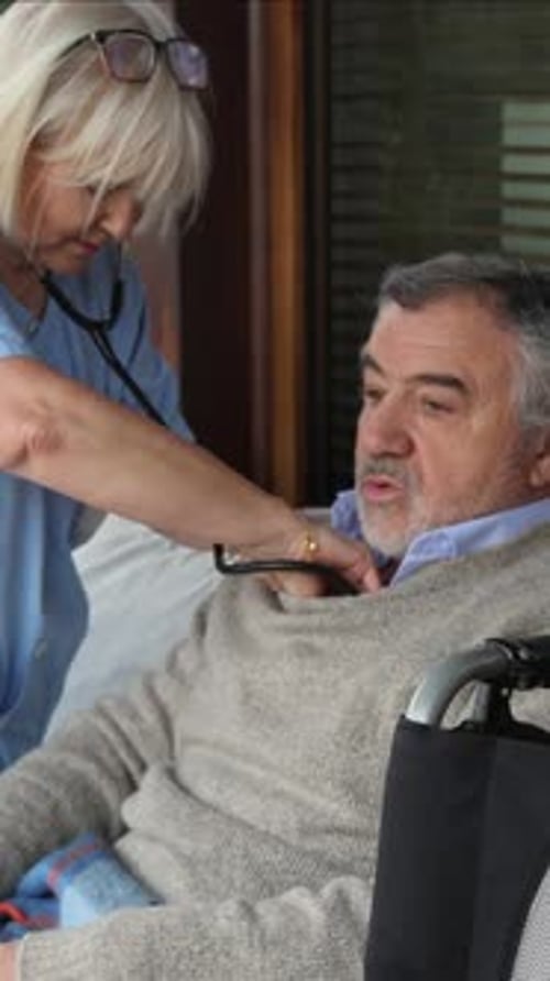 Medical Checkup: Nurse Listens to Patient with Stethoscope